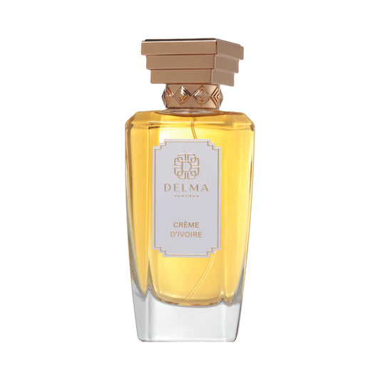 DELMA PARFUMS Crème d'Ivoire Extrait de Parfum 100 ml — flacon à facettes, capot doré en gradins et étiquette ivoire, sur fond blanc