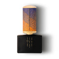 Floraïku Sand and Skin — vue arrière du flacon noir avec gravure dorée évoquant sable et peau