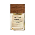 THEODOROS KALOTINIS Banane de Coco Extrait de Parfum 50 ml — second angle du flacon, étiquette dorée brossée et bouchon bois, gourmand lacté, parfum niche de Grèce